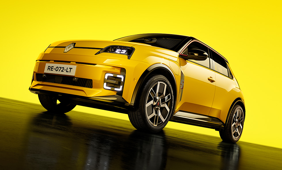 Renault 5 E-Tech electric in yellow front three-quarter shot on a yellow studio background