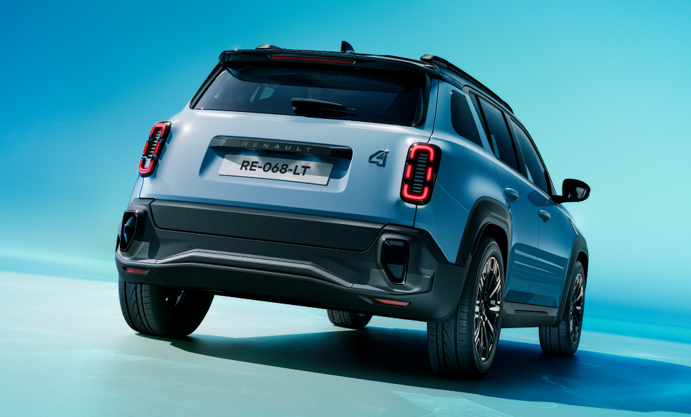 Renault 4 E-Tech electric in blue rear three-quarter shot on a blue studio background