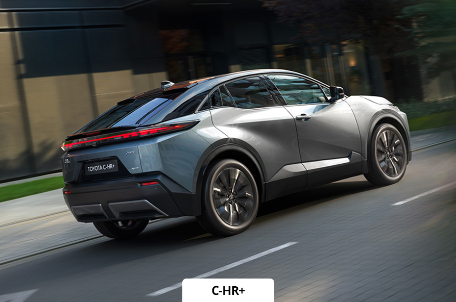 Exterior driving shot of a grey Toyota C-HR+