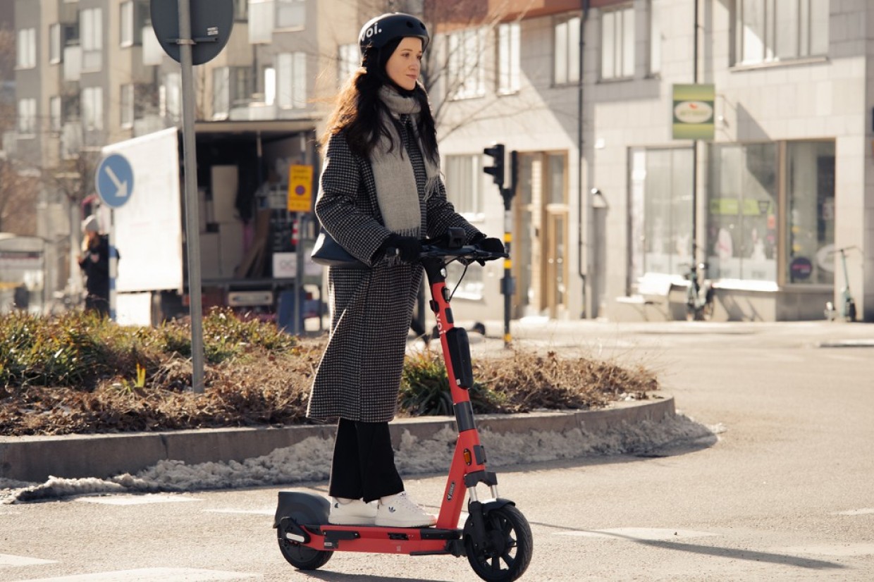 woman riding escooter