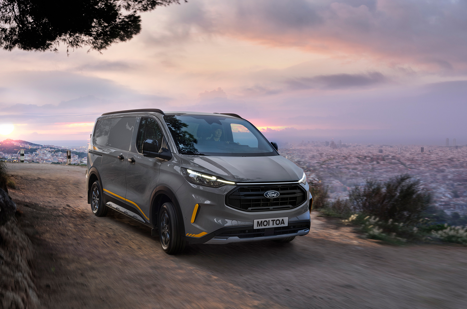 Ford Transit Custom driving on gravel front three quarters