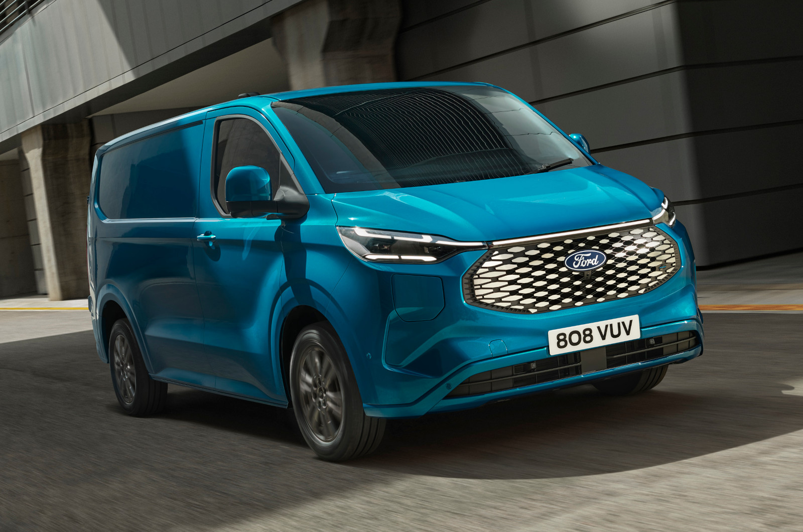 2023 Ford E-Transit Custom in light blue, driving