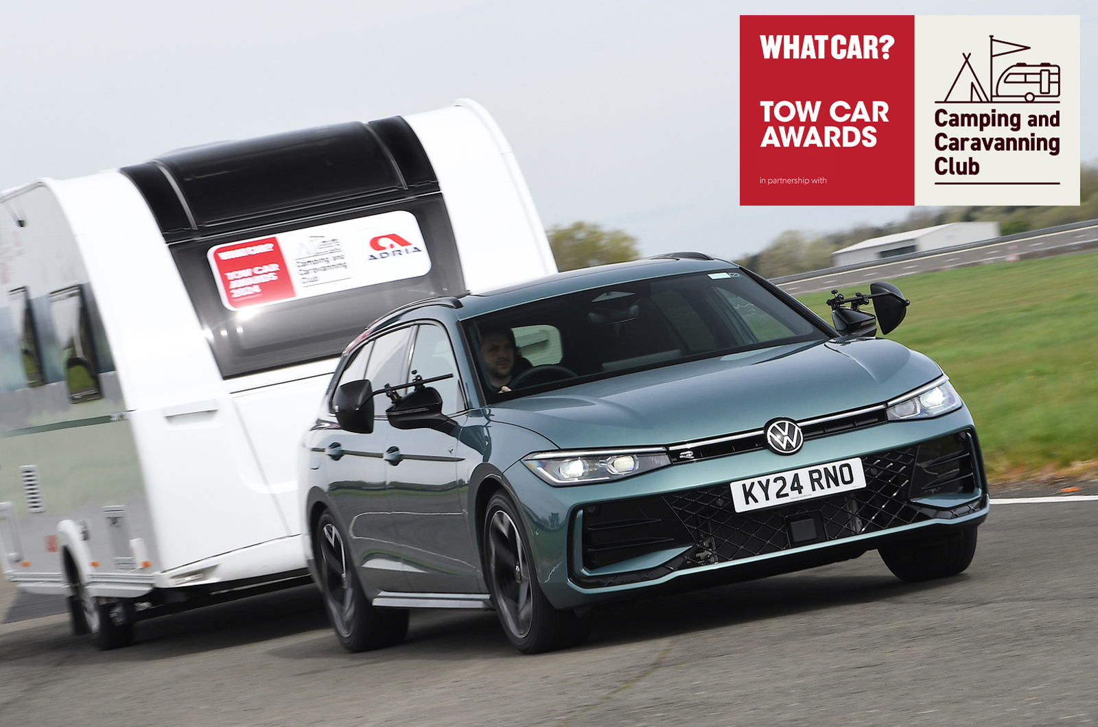 2024 Volkswagen Passat pulling a caravan