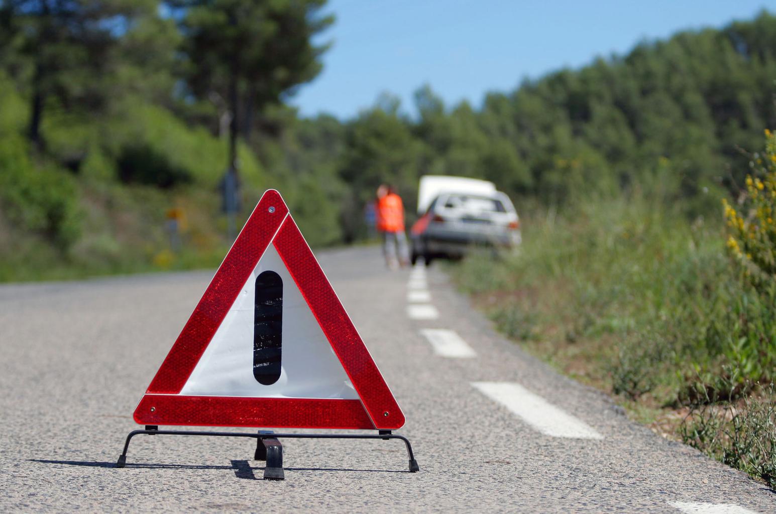 broken down car and warning triangle
