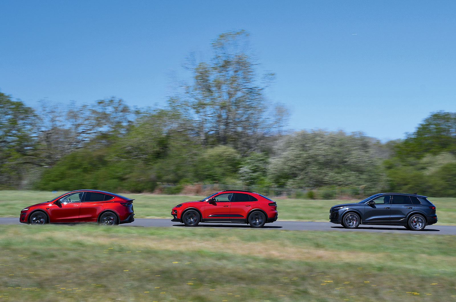 Audi SQ6, Porsche Macan GTS and Tesla Model Y side driving