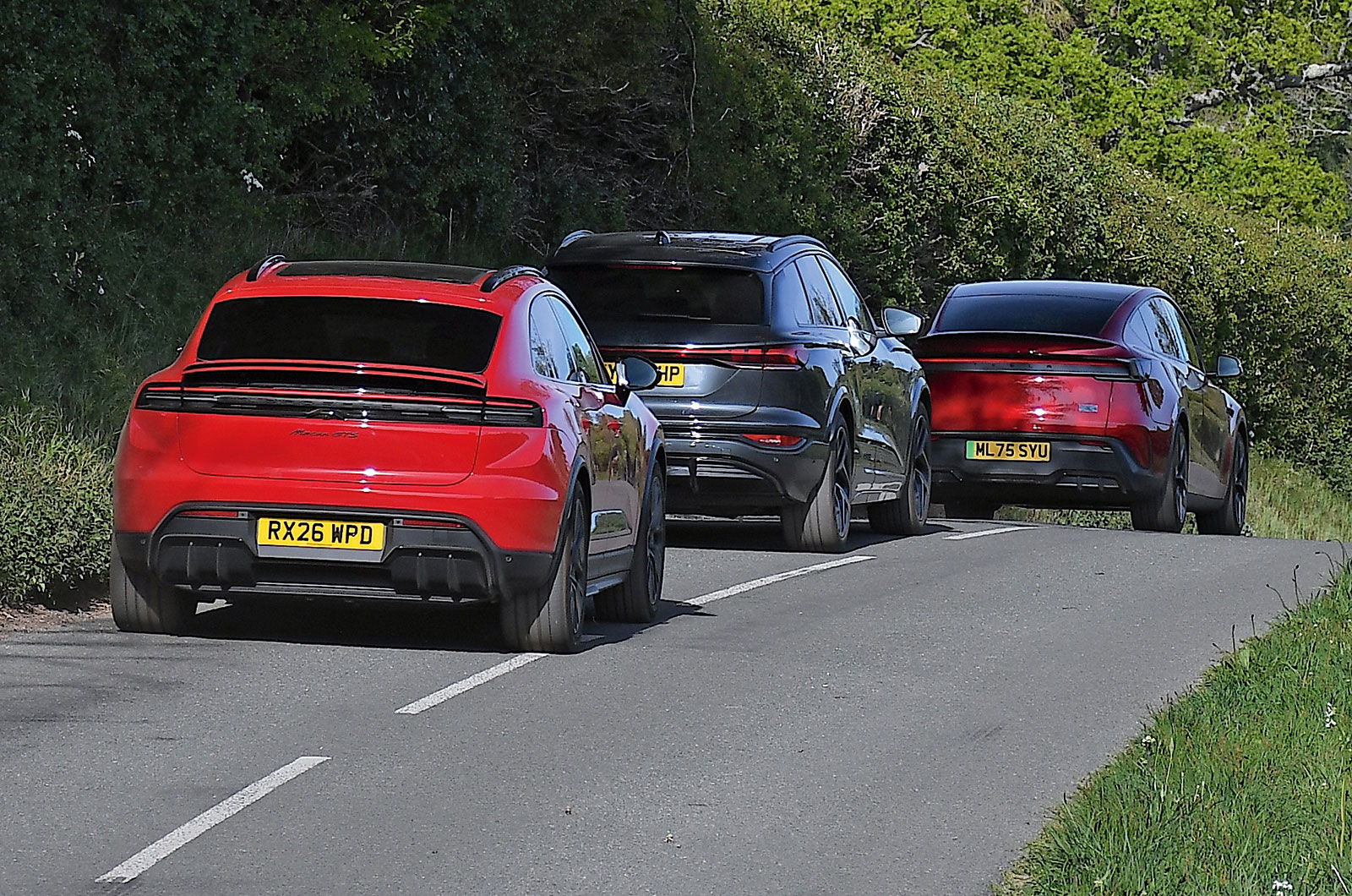 Audi SQ6, Tesla Model Y and Porsche Macan GTS rear driving