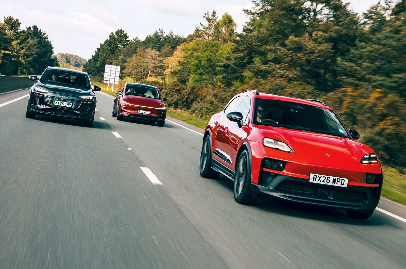 Porsche Macan GTS, Tesla Model Y and Audi SQ6 driving front