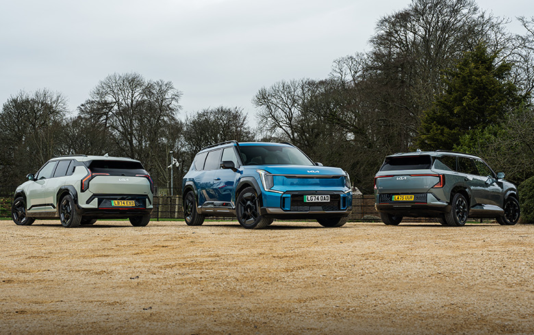 Kia EV3, EV5 and EV9 parked together on gravel