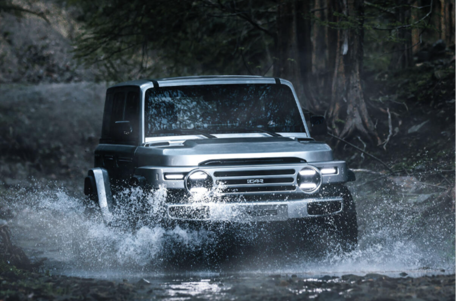 A silver iCaur V23 Chinese off roader driving through puddle