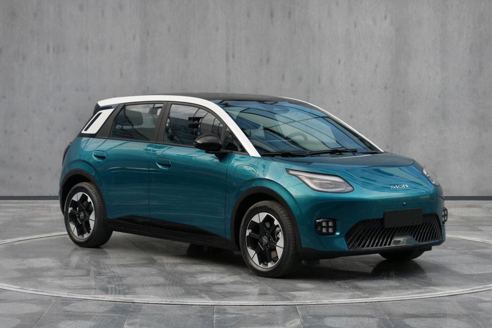 A blue Aion UT electric hatchback from China