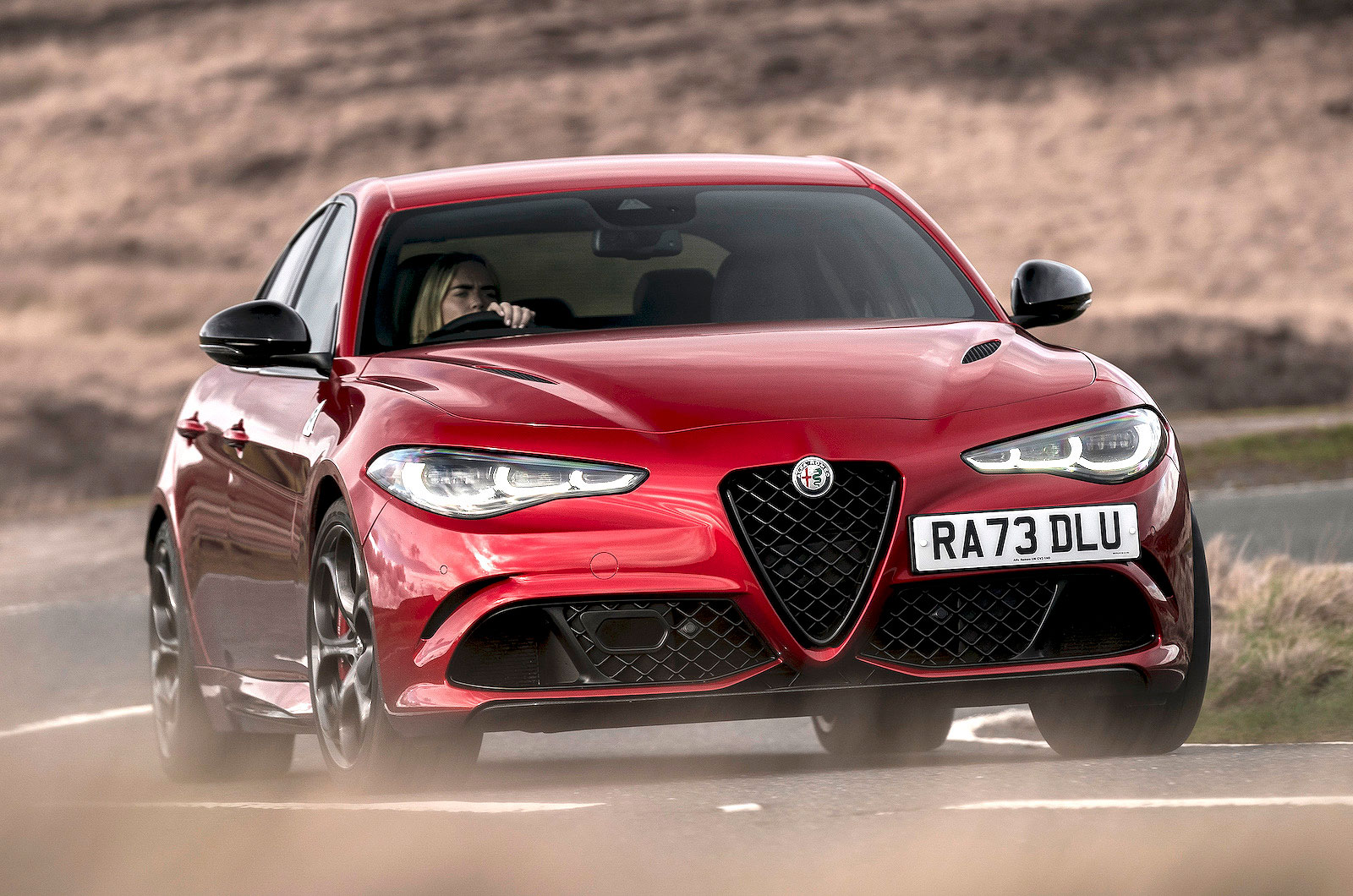 Red Alfa Romeo Giulia Quadrifoglio front cornering