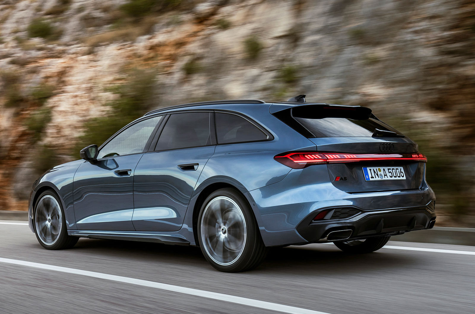 Audi A5 Avant estate blue driving rear