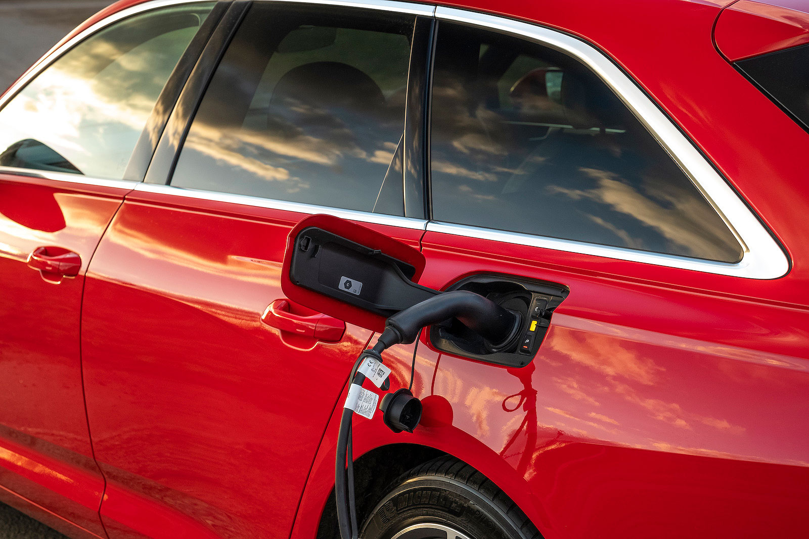 Red Audi A6 Avant PHEV charging socket