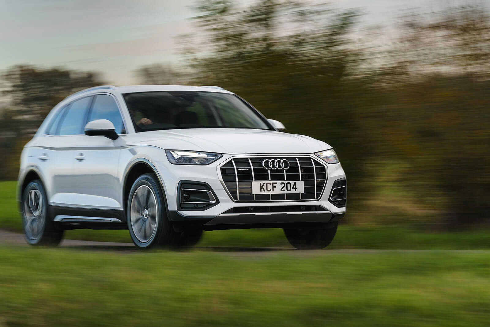 White Audi Q5 front right driving