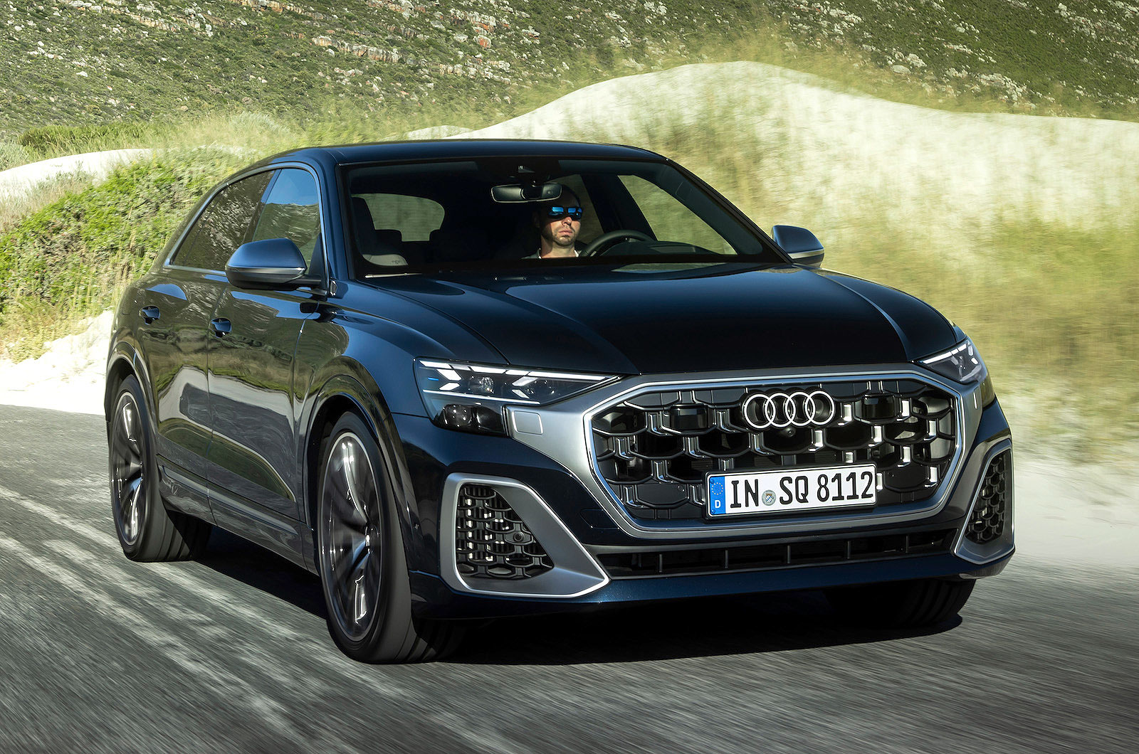 Blue Audi SQ8 front cornering