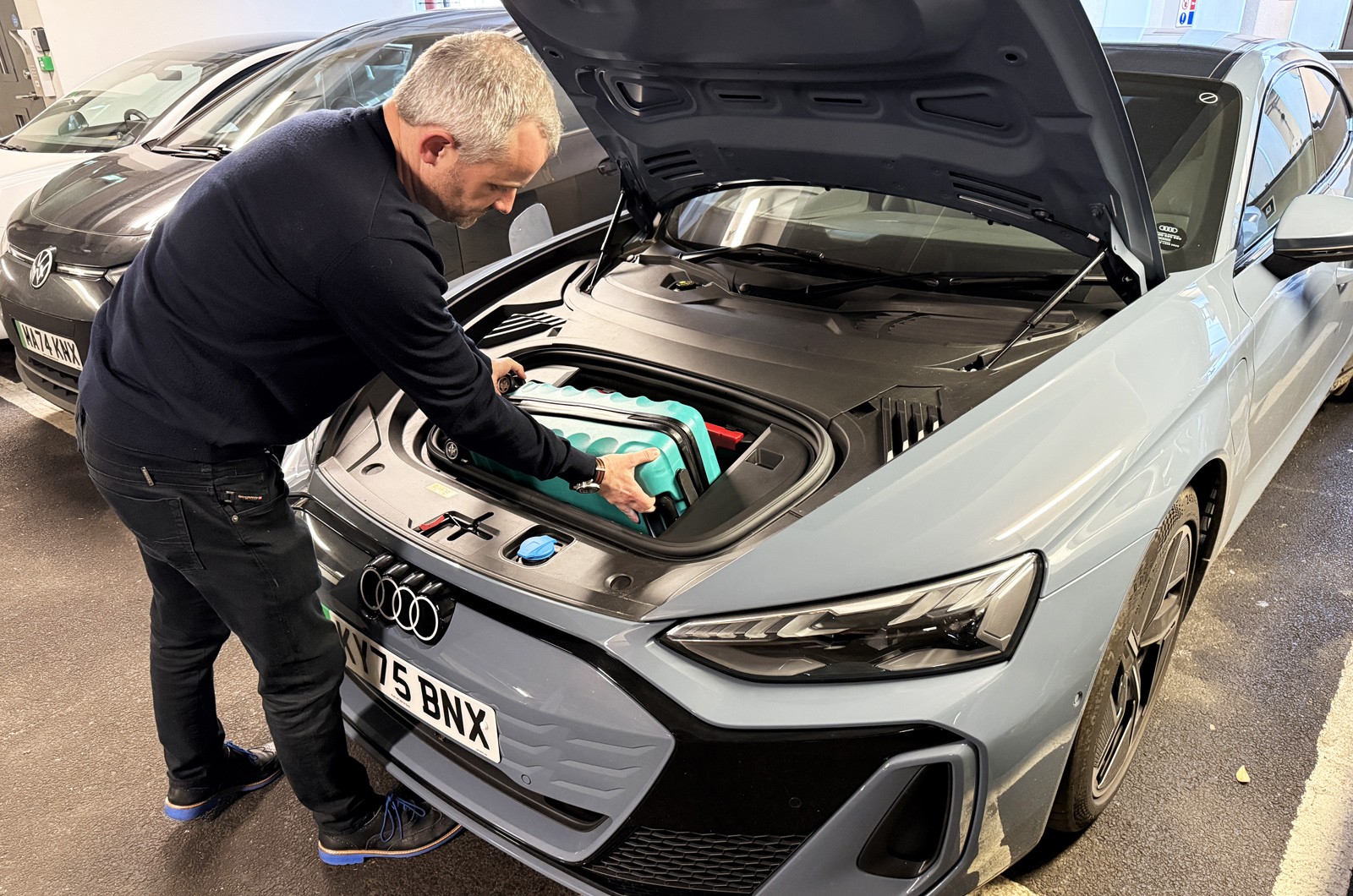 Audi E-tron GT LT - putting suitcase in frunk