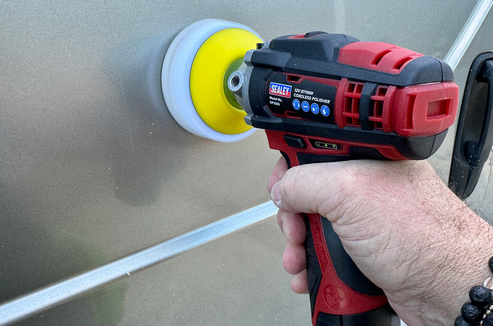 Car polisher polishing bodywork