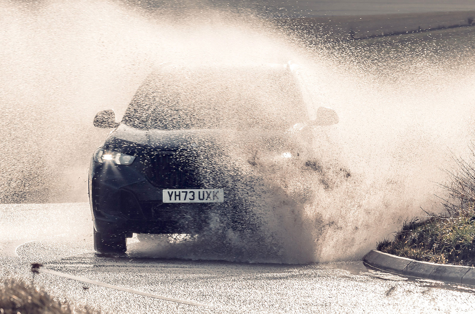BMW X5 splashing through water