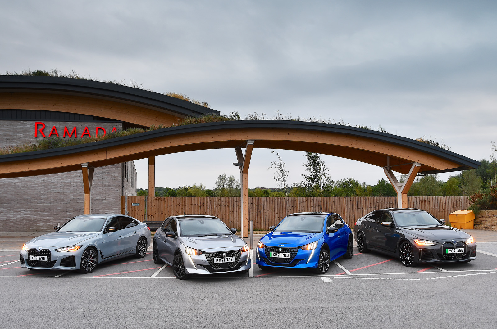 BMW and Peugeot electric cars at motorway services