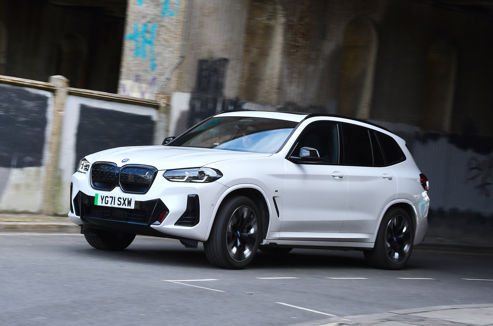 White BMW iX3 left driving