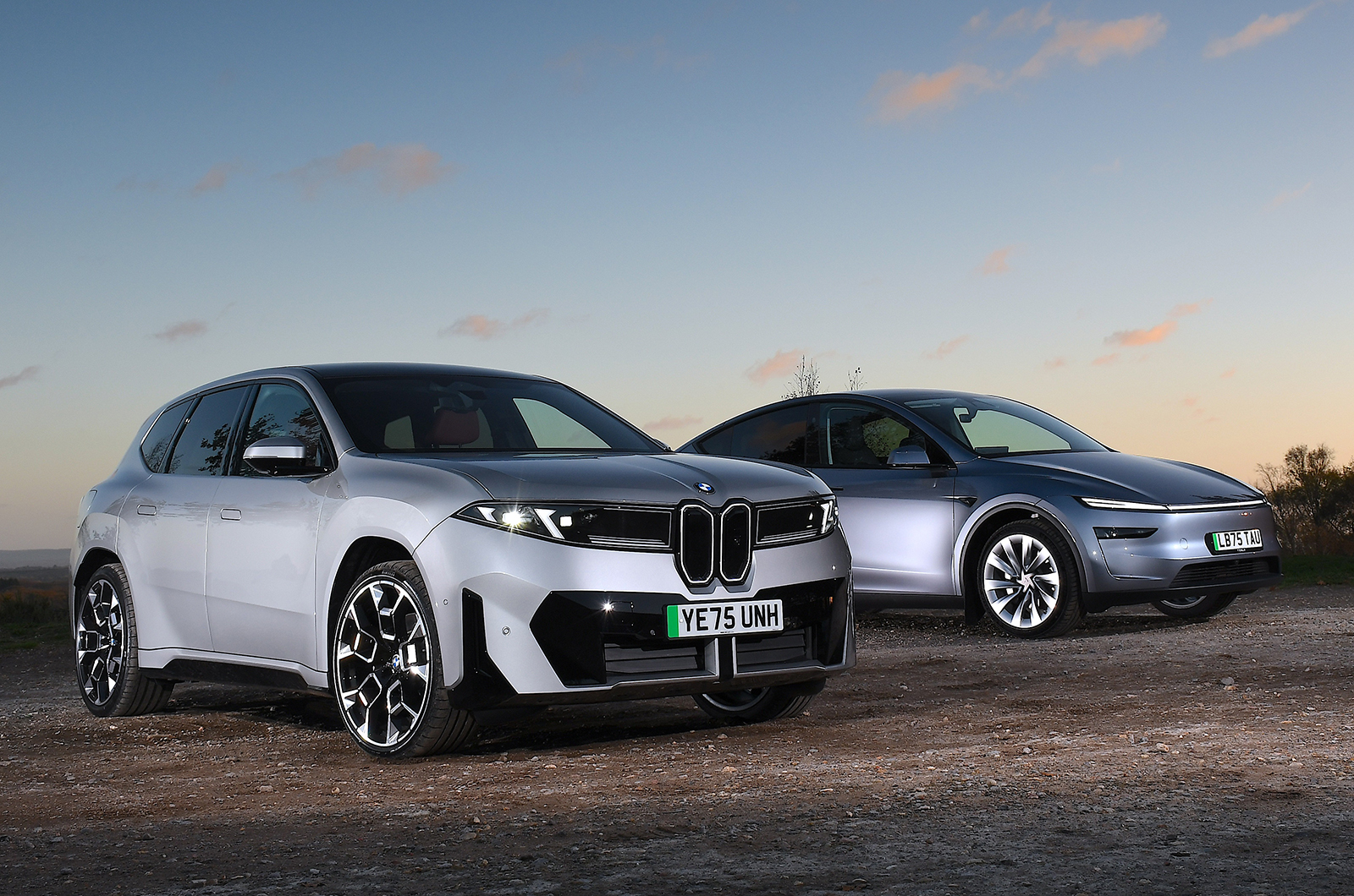 BMW iX3 and Tesla Model Y front static