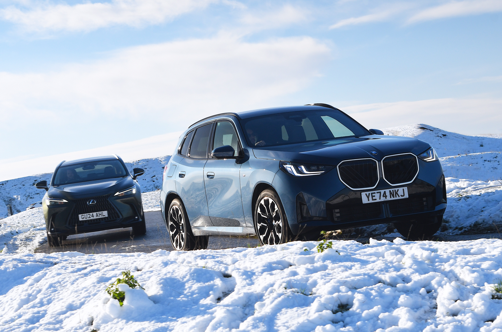 BMW X3 vs Lexus NX fronts driving