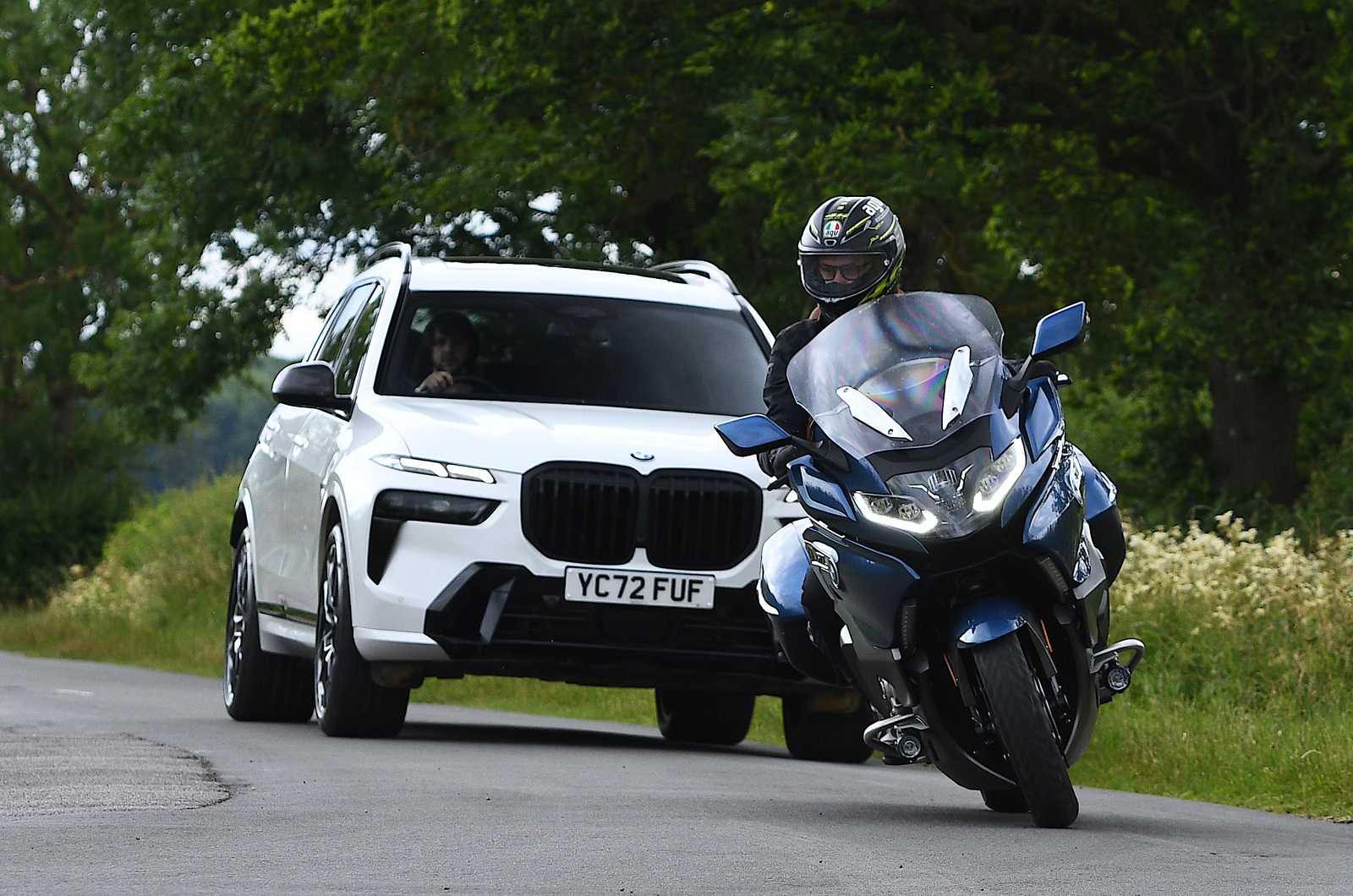 BMW X7 40i LT following K1600 GTL