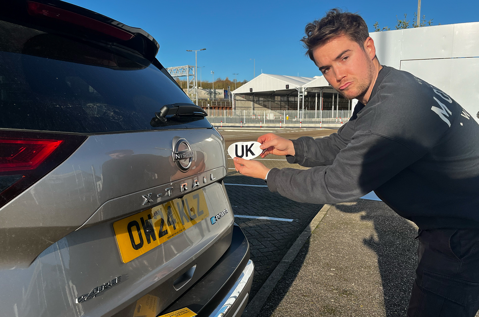 Applying UK sticker to the X-Trail