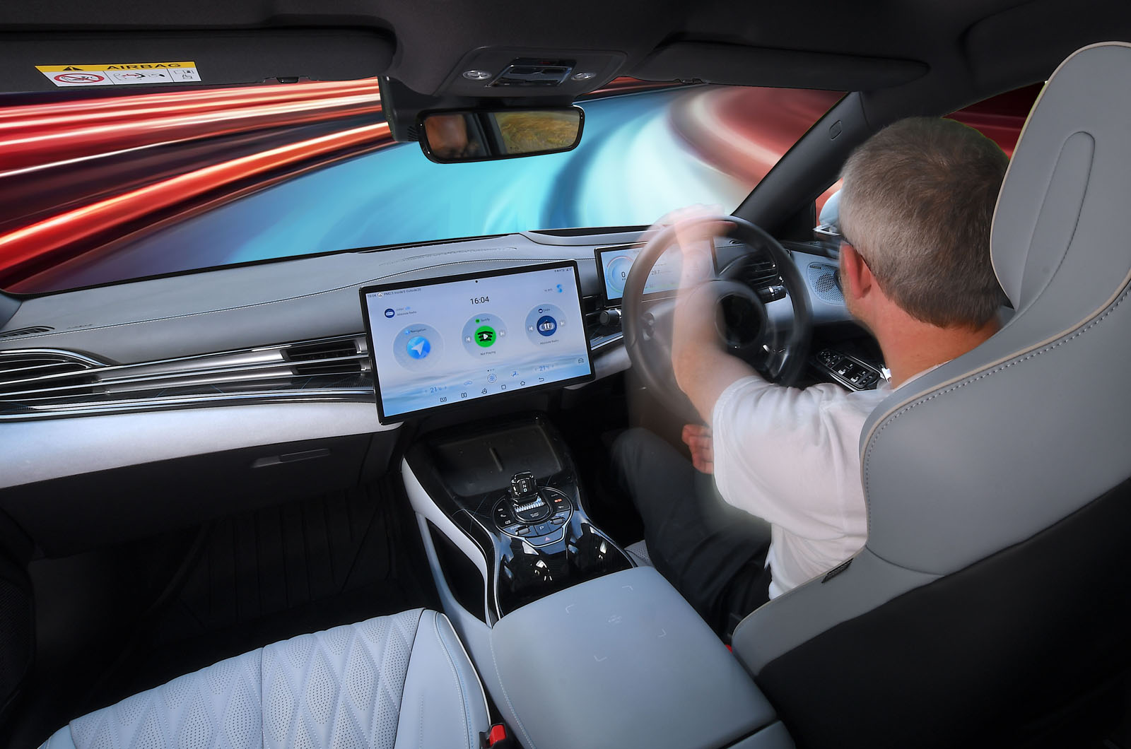 BYD Seal LT over-the-shoulder driving pic at warp speed