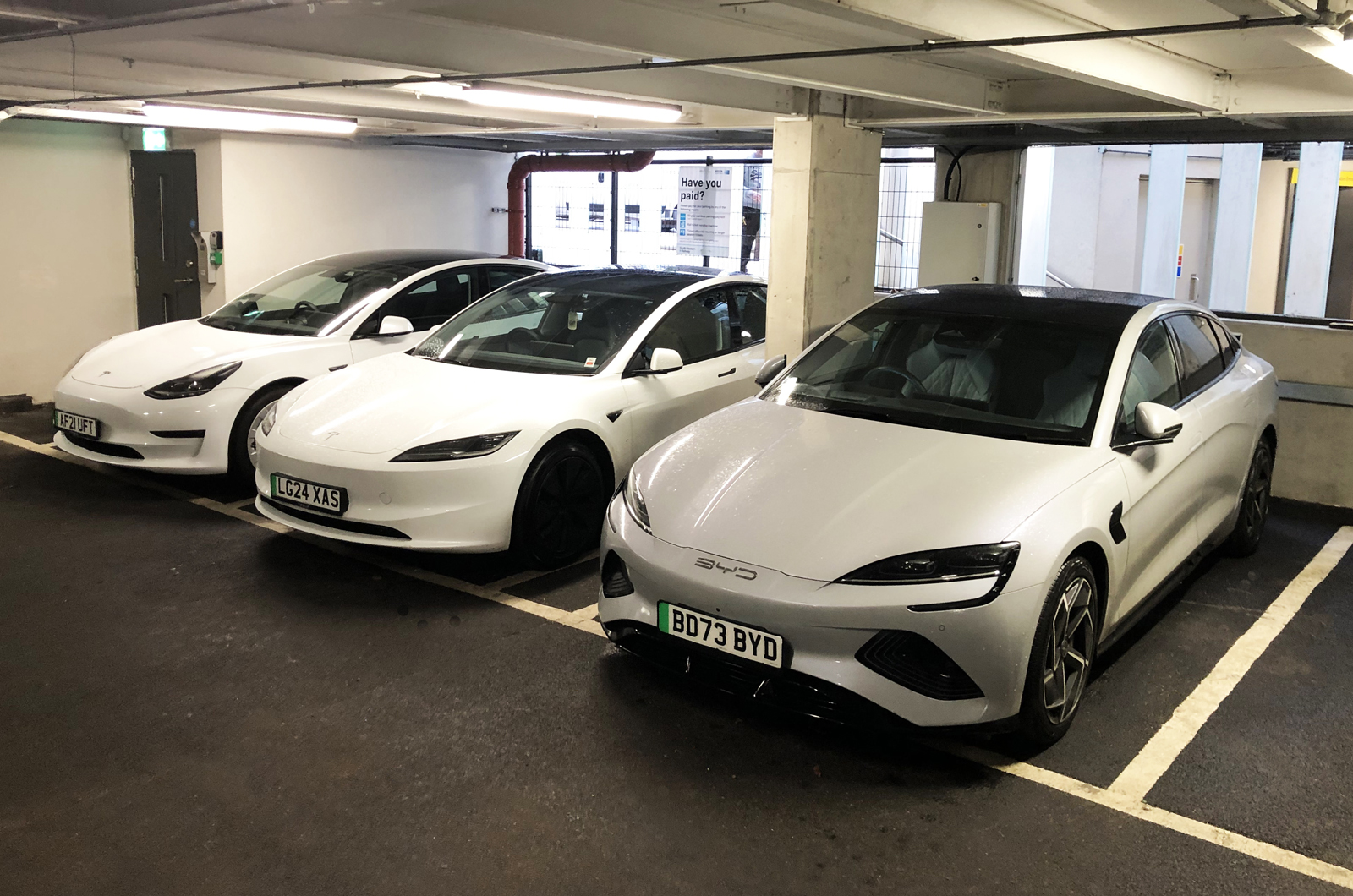 BYD Seal LT parked next to Tesla Model 3s