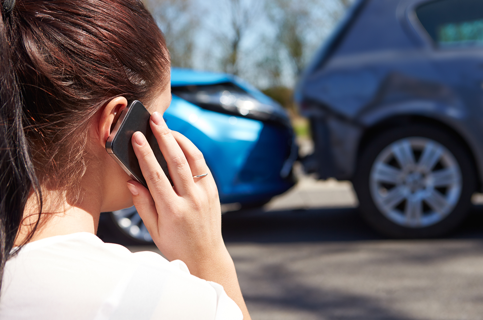 Driver calls insurance provider after being involved in a road accident