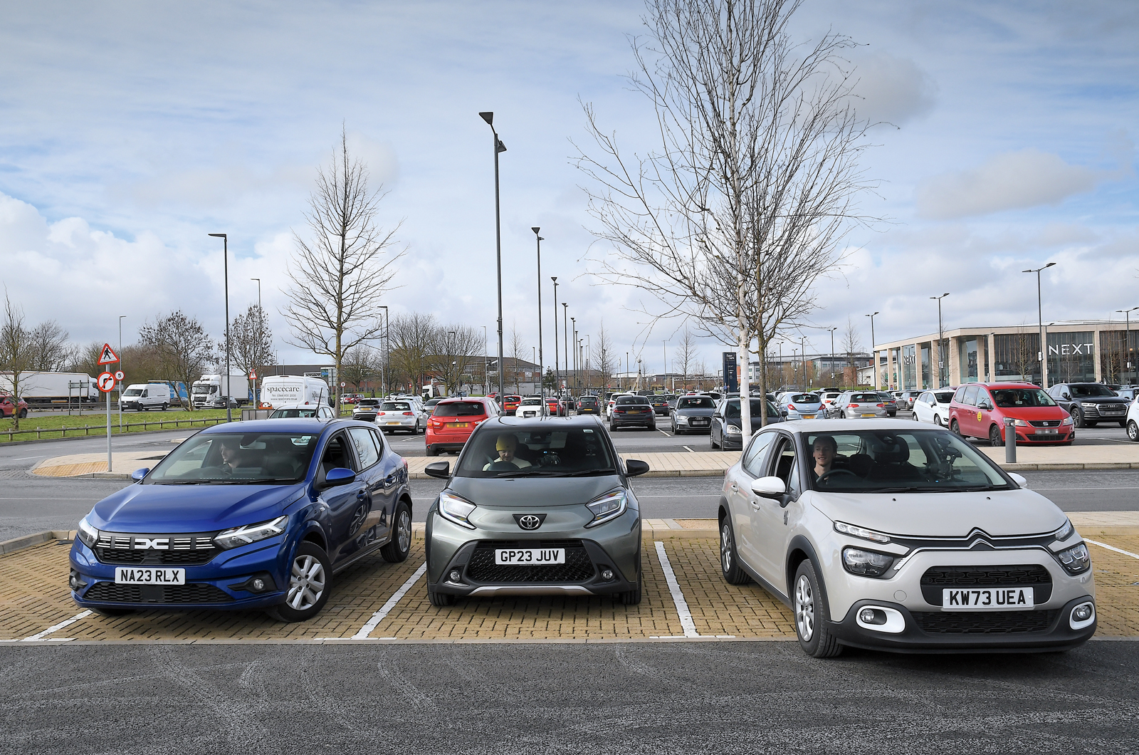 Dacia Sandero with Toyota Aygo X and Citroen C3 in car park - fronts