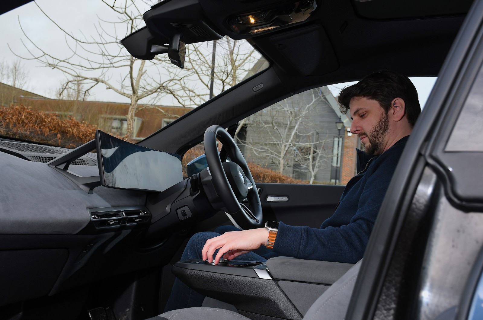 Dan using the BMW iX's rotary controller
