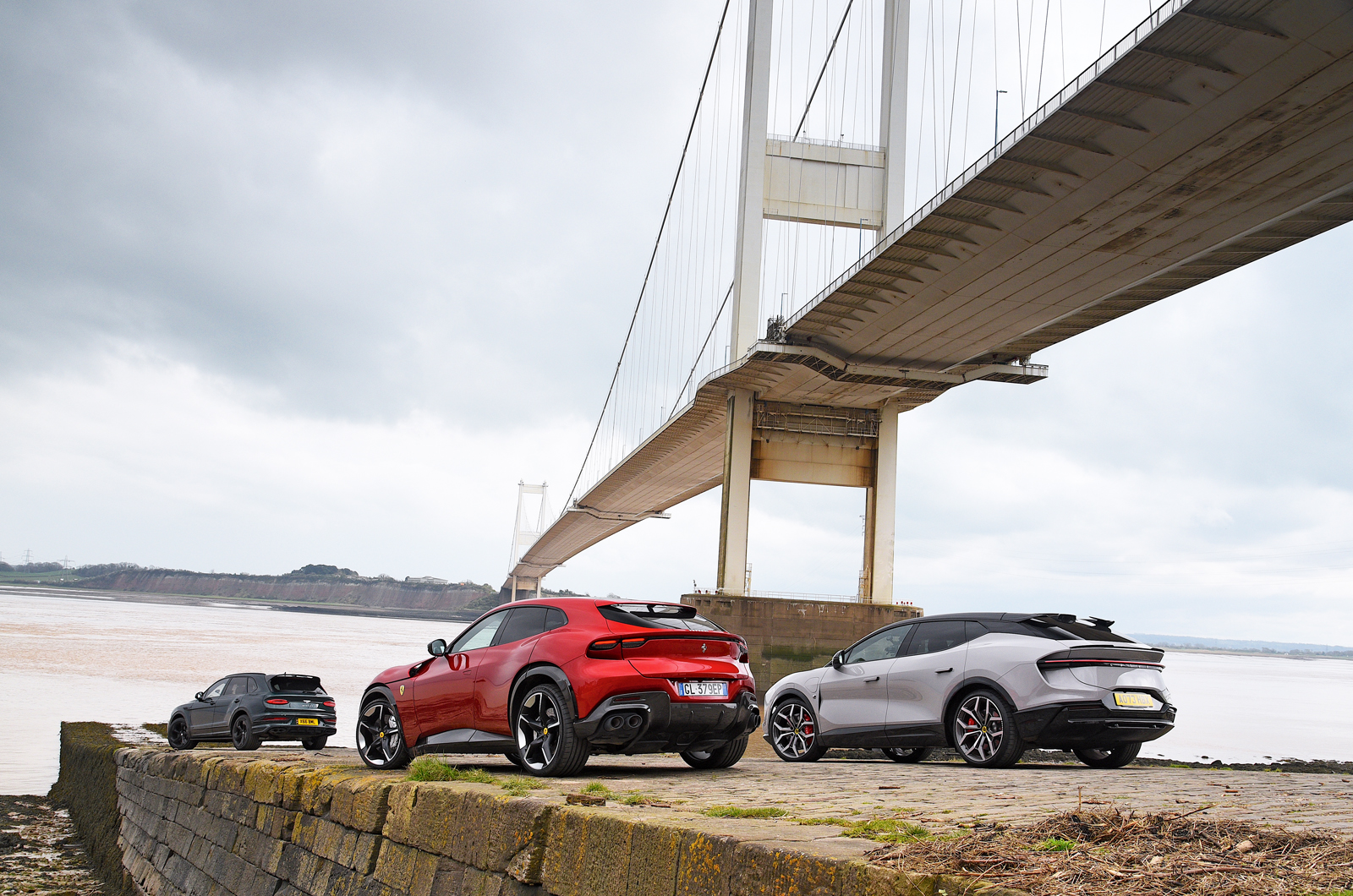 Ferrari Purosangue with Lotus Eletre and Bentley Bentayga under Severn Bridge