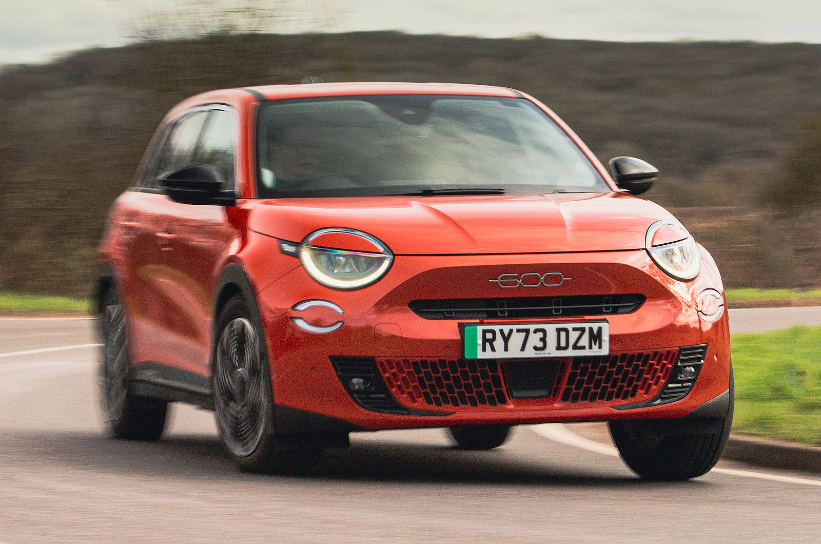 Orange Fiat 600e front cornering