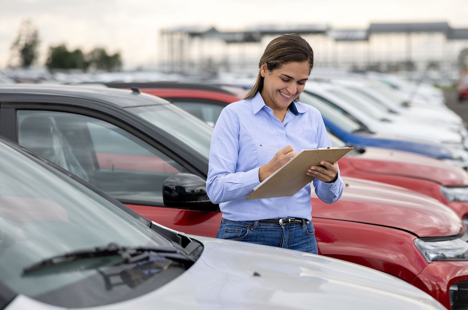 Fleet car manager with a clipboard and cars