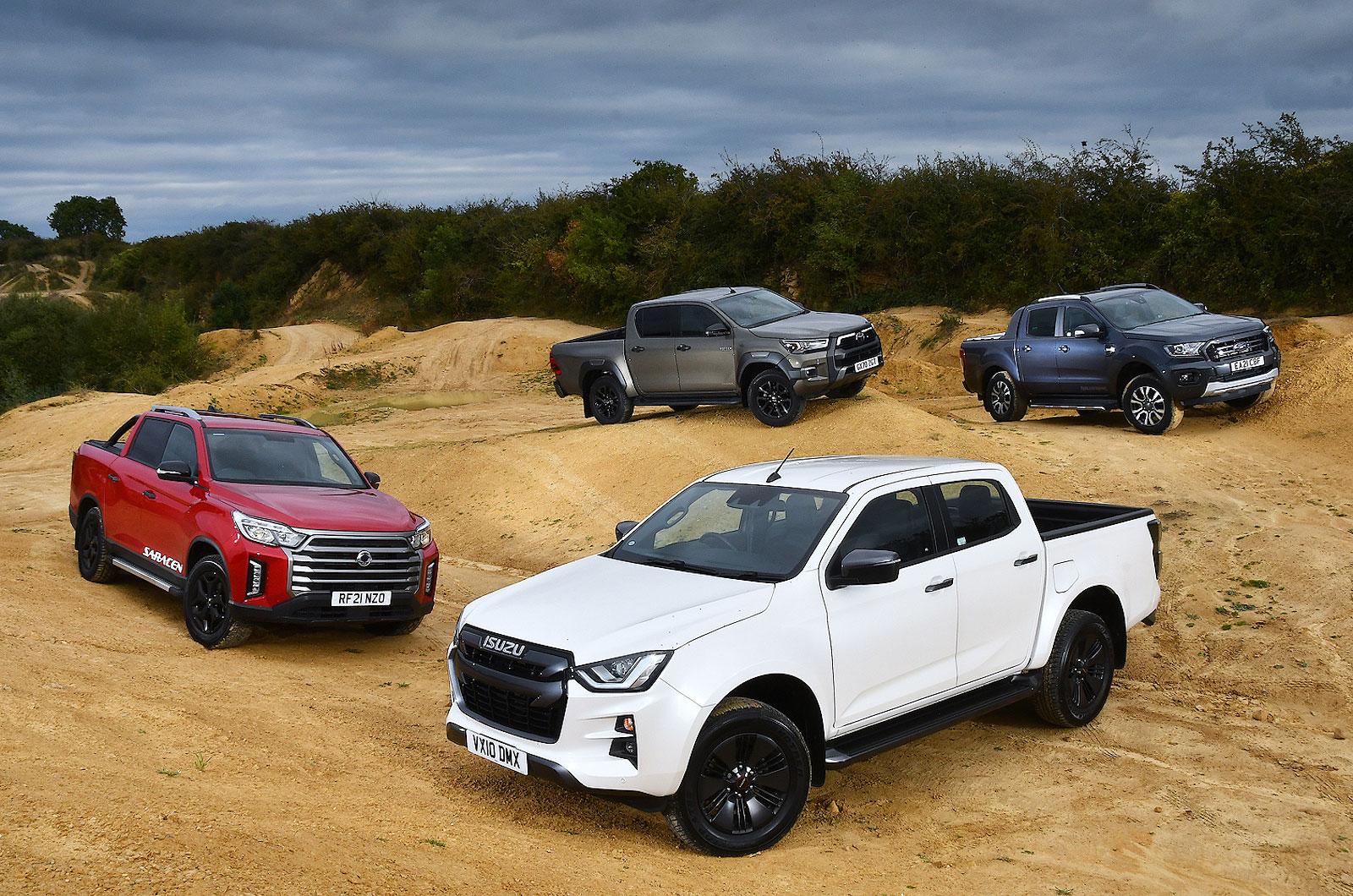 Four pick-up trucks off road