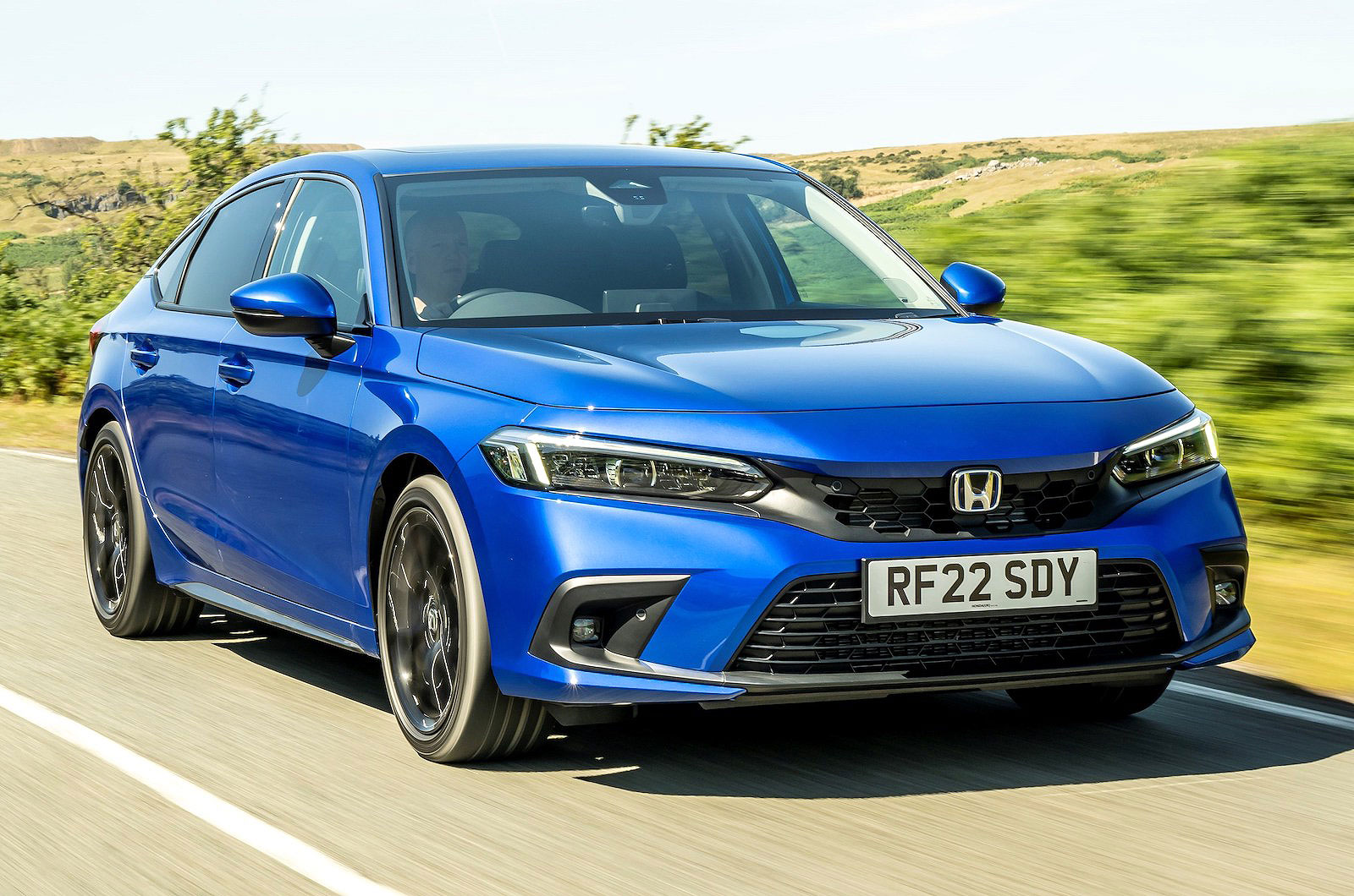 Honda Civic e:HEV front right driving