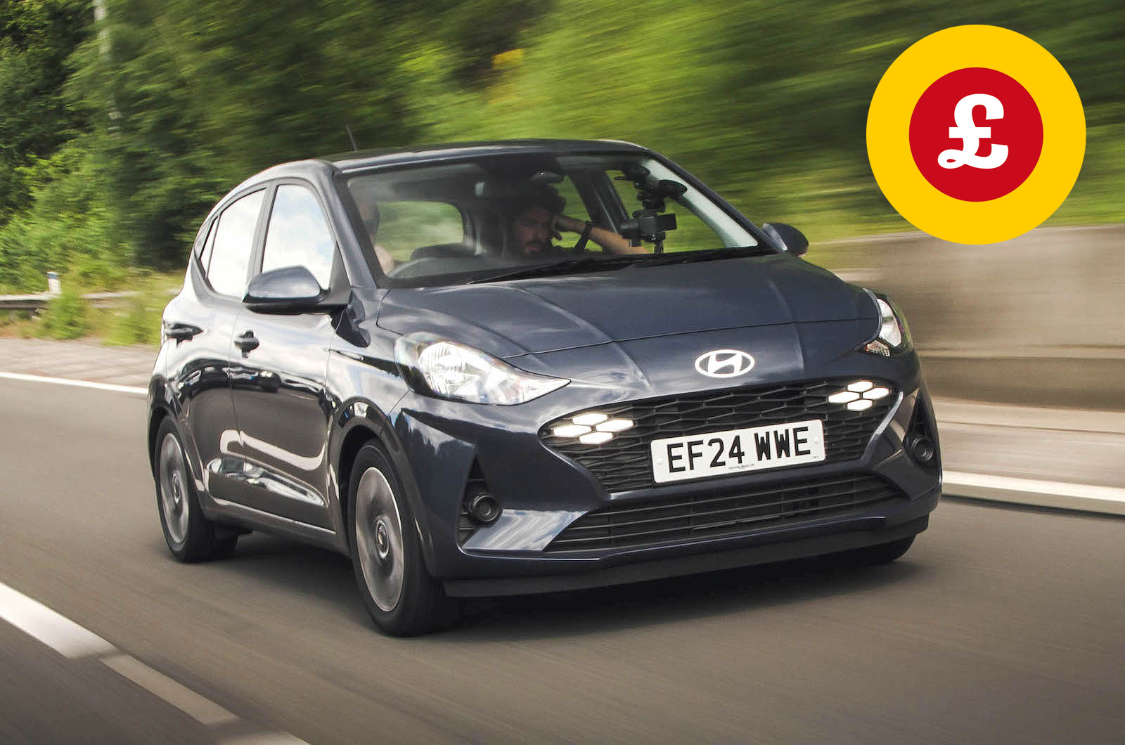 Hyundai i10 front driving with Target Price logo