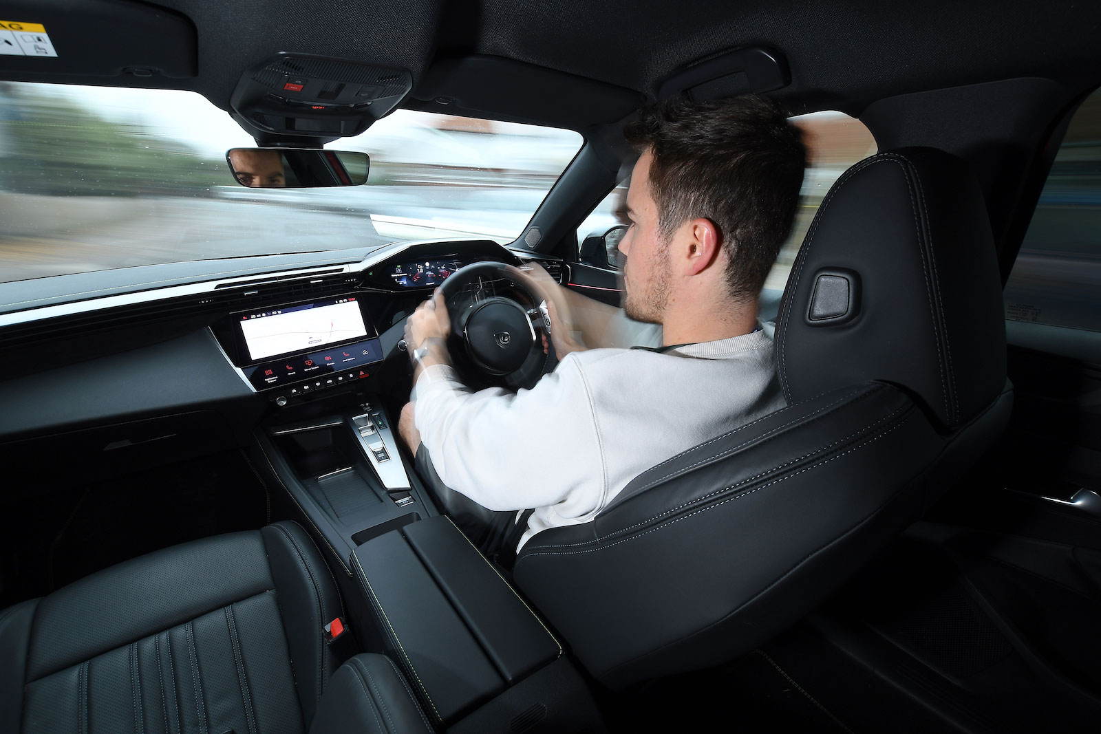 Jonty Renk test driving Peugeot 408