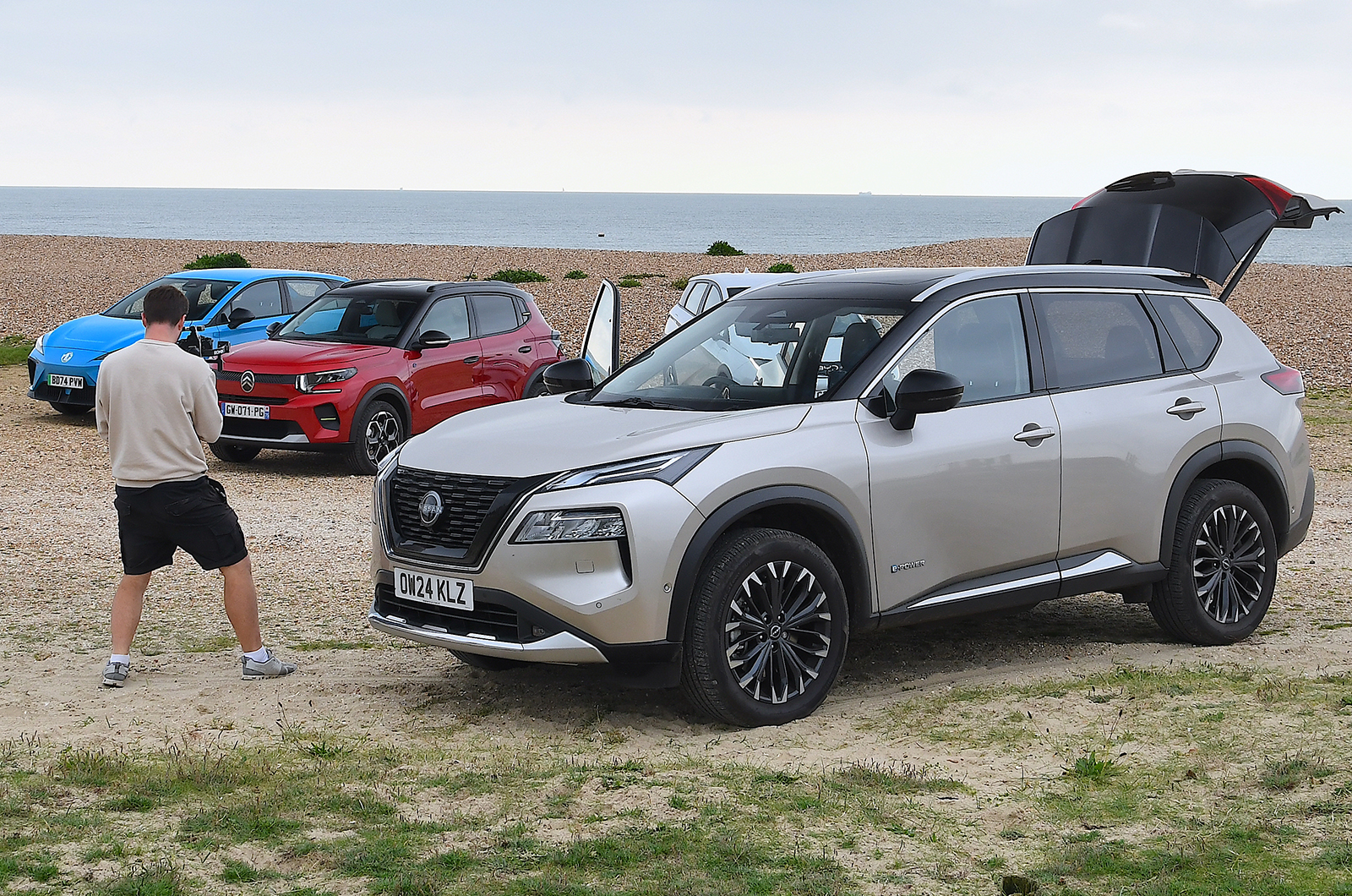 Jonty Renk filming cars with long-term Nissan X-Trail in the foreground
