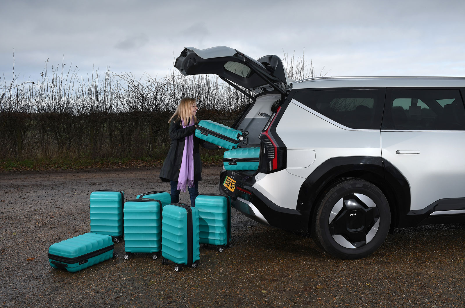 Kia EV9 Claire putting cases in boot