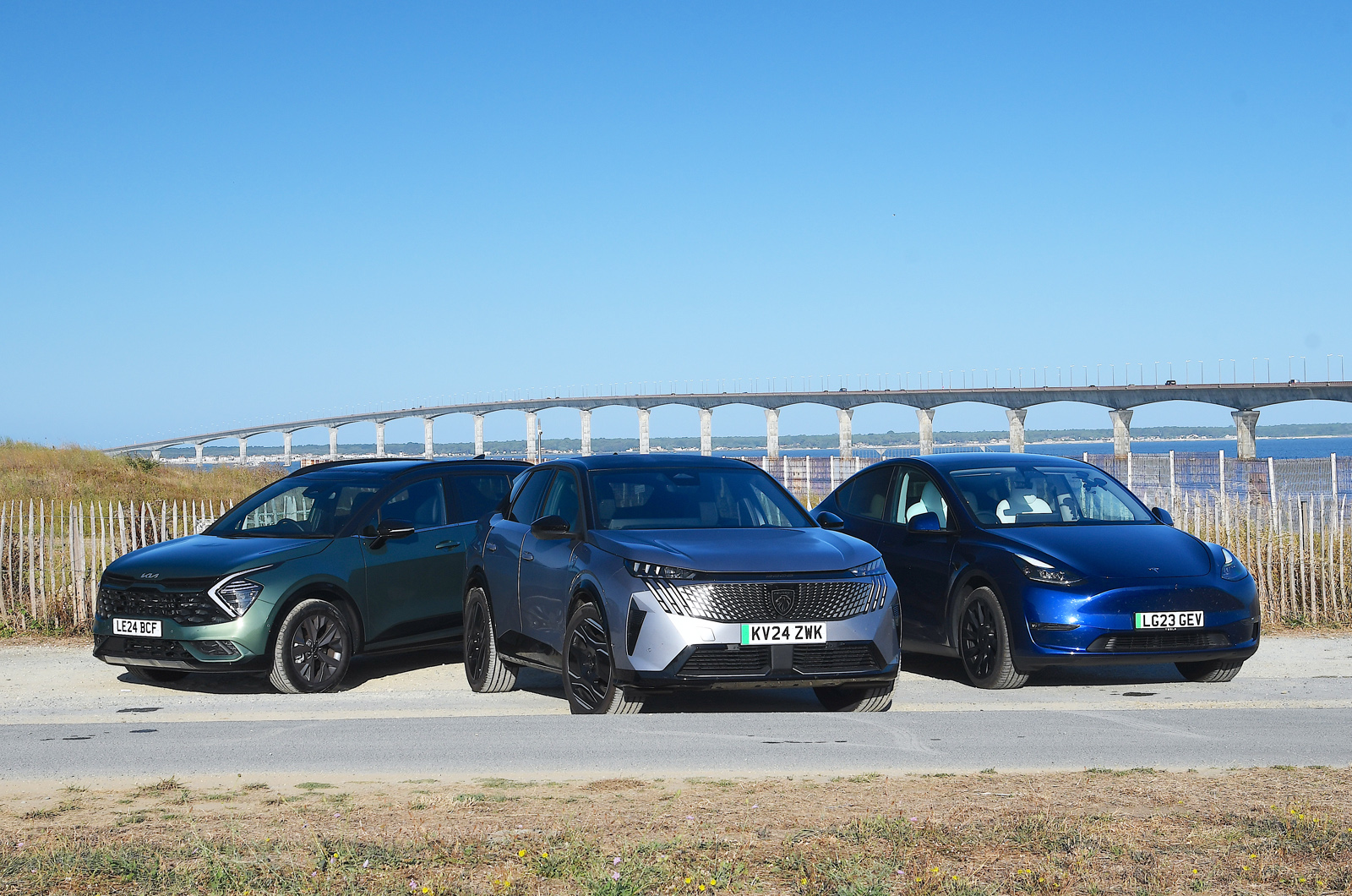 Kia Sportage vs Peugeot e-3008 vs Tesla Model Y fronts