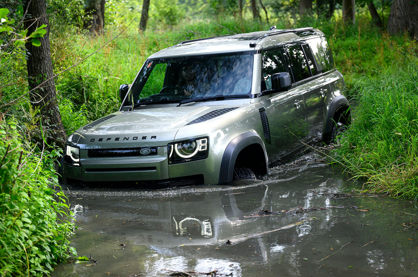 Land Rover Defender wading through water