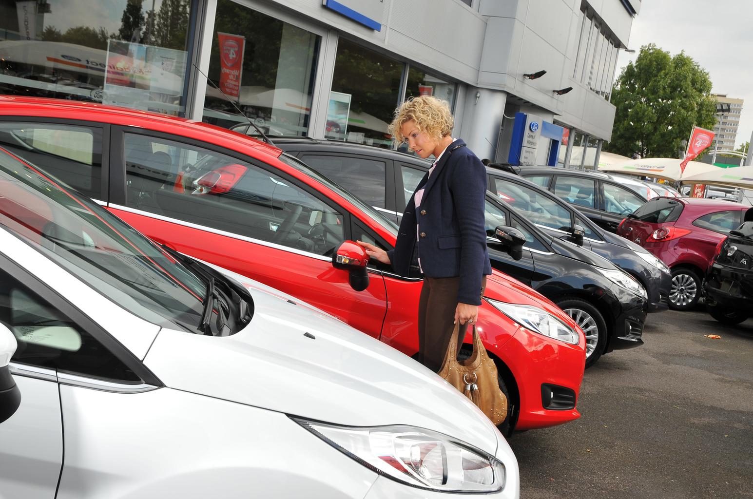 Looking at cars on forecourt
