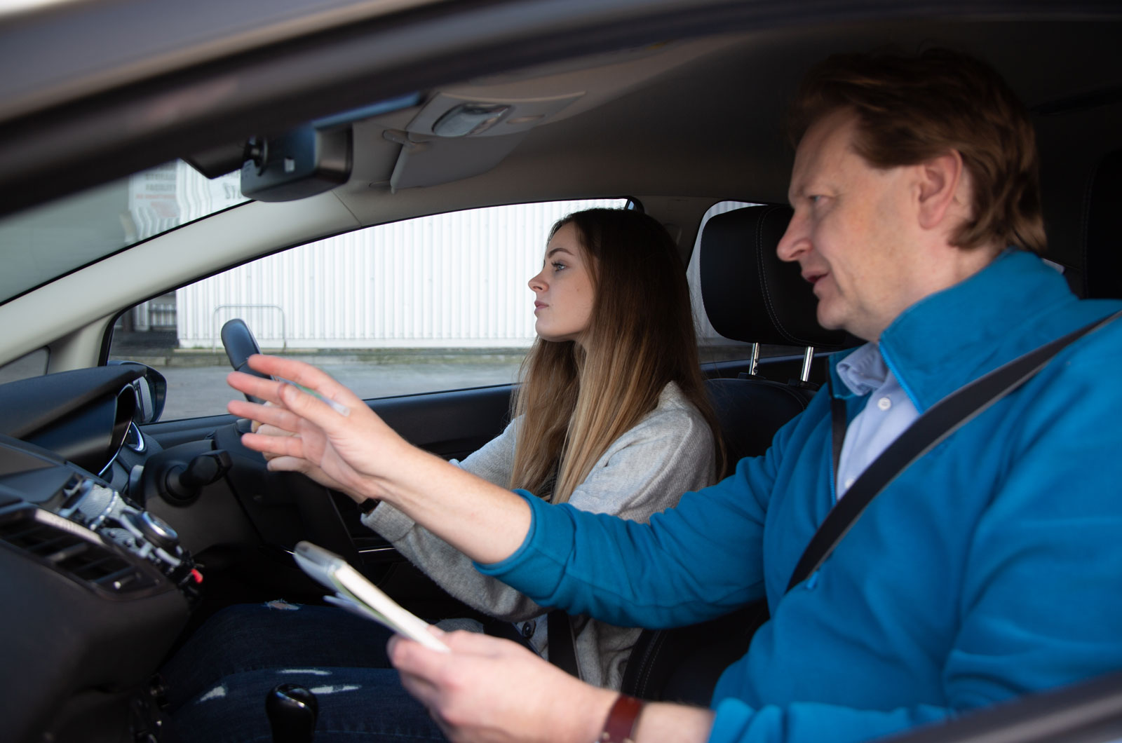 Learner and her dad in car