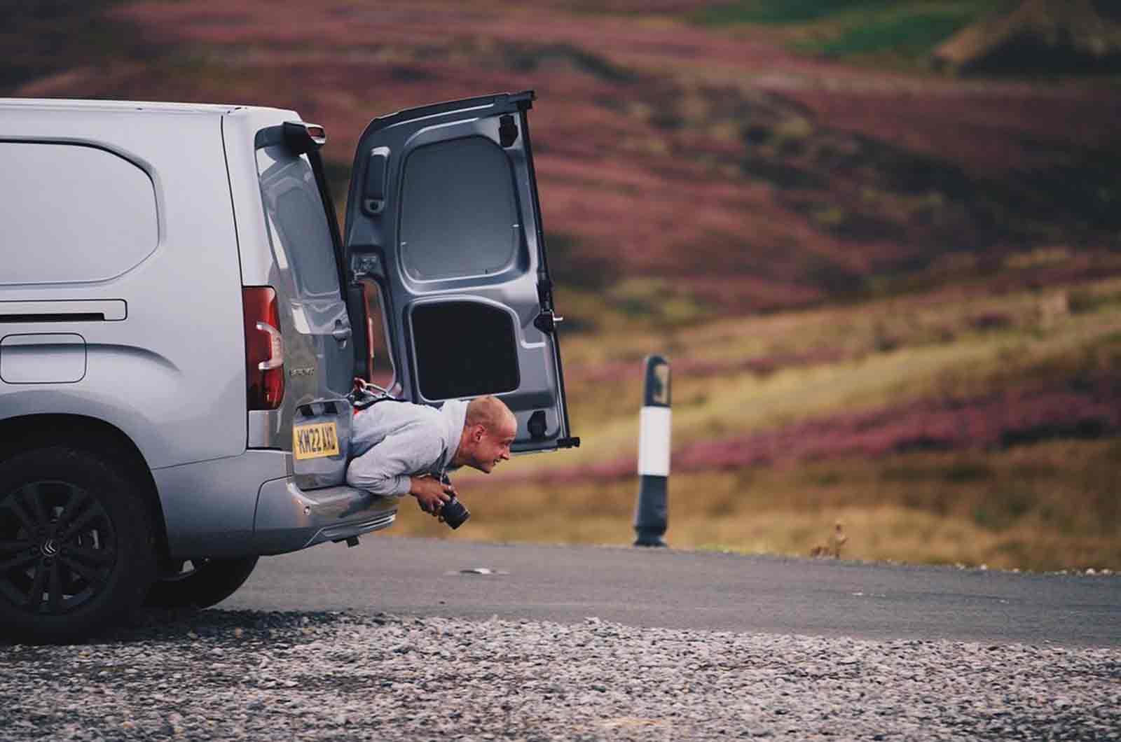 Max lying down inside Citroen Berlingo van