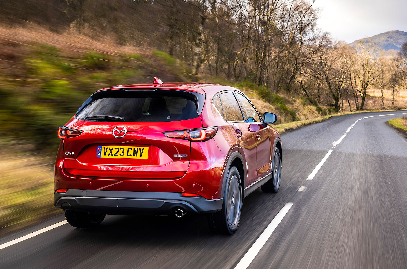 Red Mazda CX-5 rear right driving