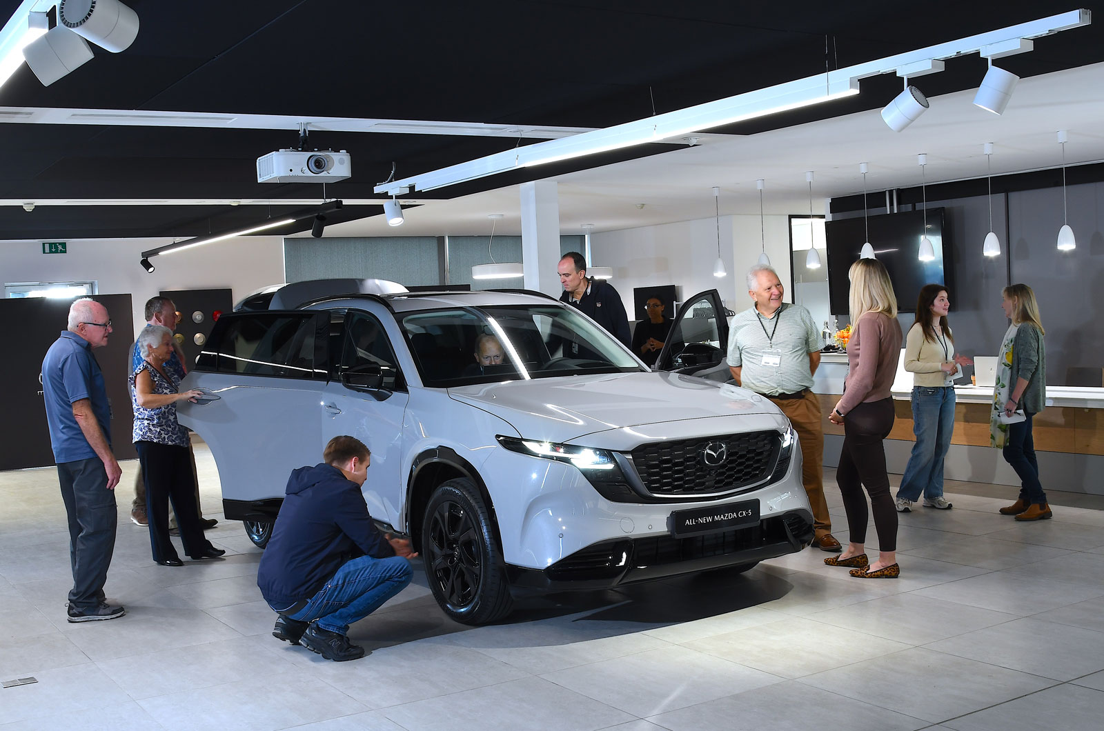 Mazda CX-5 readers around car