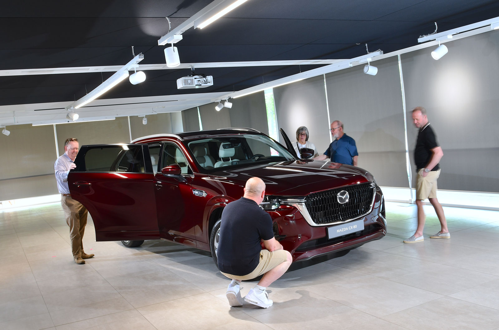 Mazda CX-80 reader test team main image readers looking at car